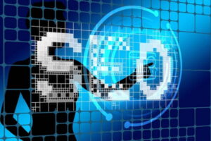 Computer screen showing a person touching the letters SEO